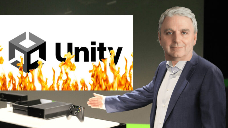 Doctored image of Don Mattrick presenting the Xbox One, instead showing John Riccitello pointing to burning Unity logo