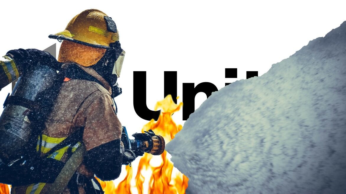 Unity logo on fie being sprayed by firefighter